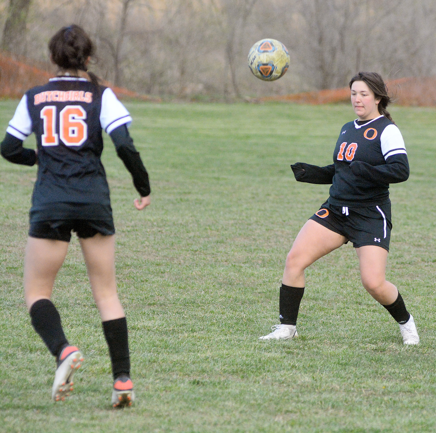 Avery Bastunas (right) waits for the ball to come down on the ground before playing it during the Dixon Girls Soccer Tournament last week against Belle’s Lady Tigers. OHS will have four home matches next week beginning Monday against Battle (Columbia) at 5:30 p.m.